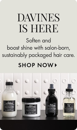 DAVINES IS HERE | Soften and boost shine with salon-born, sustainably packaged hair care. SHOP NOW > | Image of new DAVINES products showcased on a shelf.