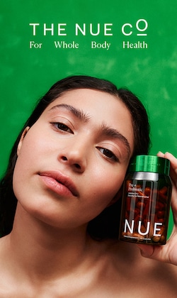 The Nue Co. For Whole Body Health. Image of model holding product.