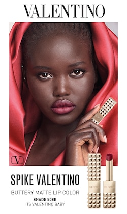 Valentino. Spike Valentino, buttery matte lip color. Shade 508R, it's valentino baby. image if model and product.